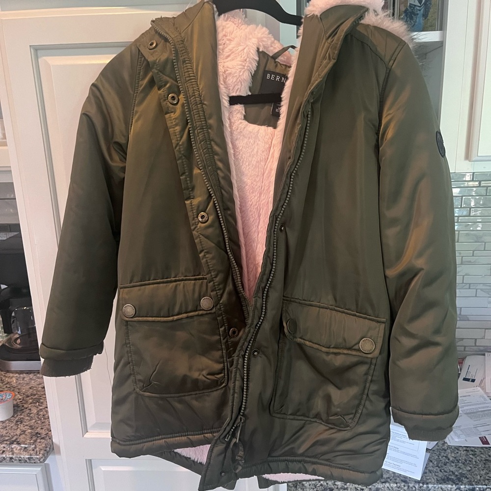 Army green puffer with pink fur lining and fur hood